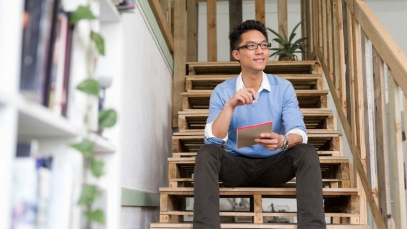 portrait-of-young-businessman-in-casual-P86QBSV-637x478