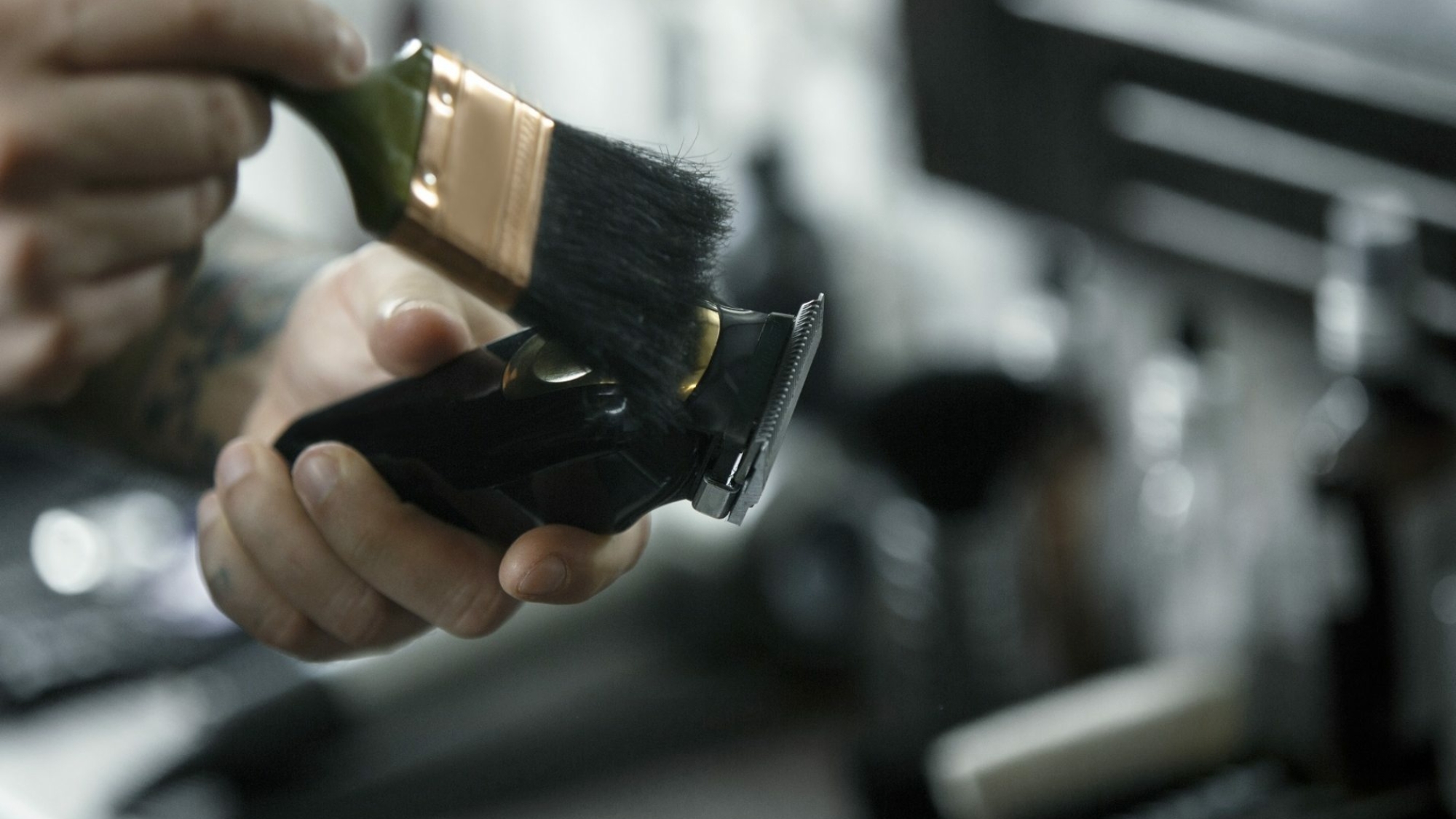 The male hands and tools for cutting beard at barbershop. Vintage tools of barber shop