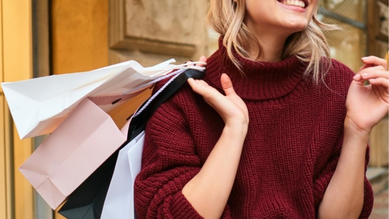 cheerful-girl-in-knitted-sweater-with-shoppi-JWHCW3Y-970x1048