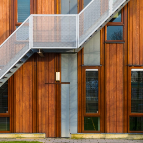 Escape stairs on a modern sustainable wooden office facade