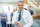 cheerful-mature-doctor-with-tablet-in-hospital-UW72G9C-637x429