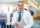 cheerful-mature-doctor-with-tablet-in-hospital-UW72G9C-637x429