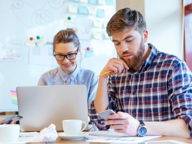 people-working-in-office-P3DBYE3-637x478
