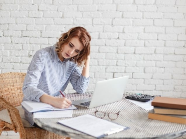 woman-freelancer-female-hands-with-pen-writing-on-P369BAX1-637x478
