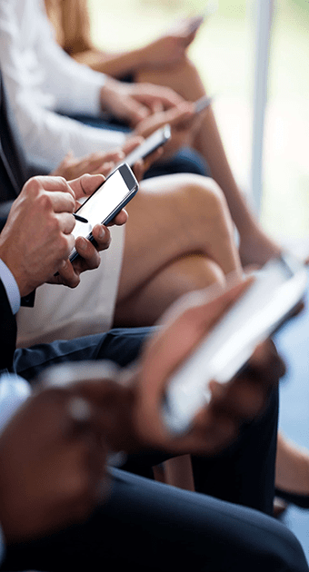 op_close-up-of-business-executives-using-mobile-8TJSZAP